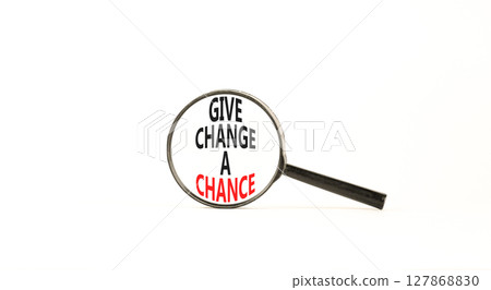 Give change a chance symbol. Concept words phrase Give change a chance in beautiful black magnifying glass. Beautiful white background. Business Give change a chance concept. Copy space. 127868830