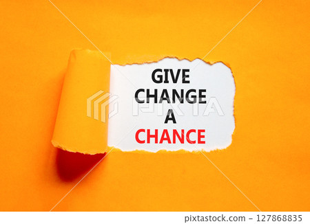 Give change a chance symbol. Concept words phrase Give change a chance on beautiful white paper. Beautiful orange paper background. Business Give change a chance concept. Copy space. 127868835
