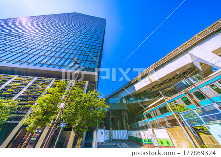 Tokyo cityscape in Japan, overlooking the World Trade Center Building South Tower and trains in front of Hamamatsucho Station Tokyo cityscape in Japan, overlooking the World Trade Center Building South Tower and trains in front of Hamamatsucho Station 127869324