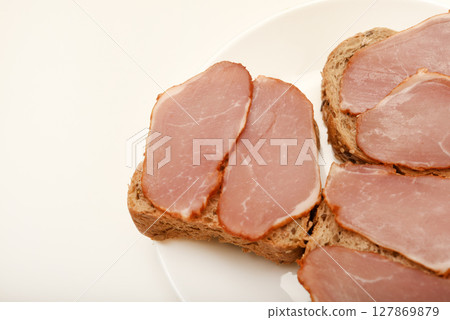 Ham sandwiches. Ham cut into thin slices. 127869879