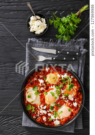 shakshuka, eggs poached in tomato vegetable sauce shakshuka, eggs poached in tomato vegetable sauce 127869986