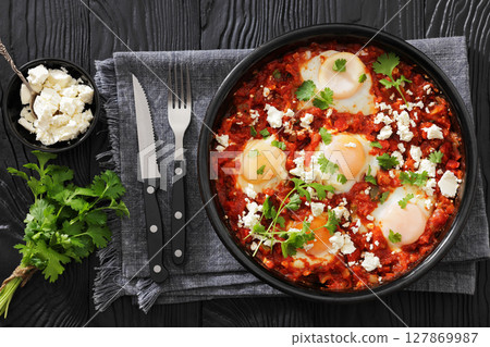shakshuka, eggs poached in tomato vegetable sauce shakshuka, eggs poached in tomato vegetable sauce 127869987