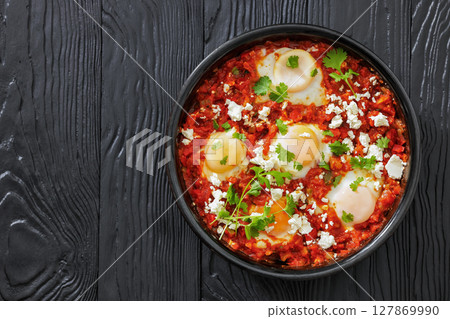 shakshuka, eggs poached in tomato vegetable sauce shakshuka, eggs poached in tomato vegetable sauce 127869990
