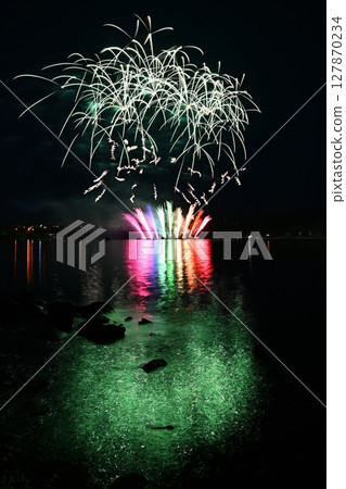 Beautiful colorful fireworks with reflections in water. Brno dam, the city of Brno-Europe. International Fireworks Competition. 127870234