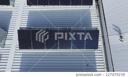 Solar Panels on the roof of a commercial building Solar Panels on the roof of a commercial building 127870239