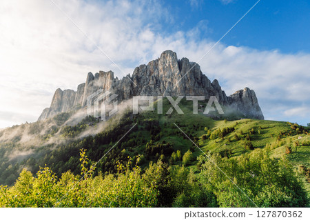 Park Bolshoy Tkhach mount with fog, sky and sunlight. Caucasus Mountains in Russia 127870362