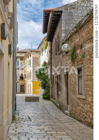 Historic Mediterranean stone street architecture colorful buildings in Porec, Croatia. 127870430