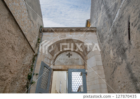 Euphrasian basilica stone archway church entrance, latin inscription. Porec, Croatia. 127870435