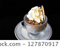 Cup of ice cream with crumble nuts and whipped cream in Keerbergen, Flemish Brabant, Belgium 127870917