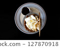Cup of ice cream with crumble nuts and whipped cream in Keerbergen, Flemish Brabant, Belgium 127870918