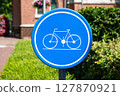 Blue circle sign indicating bike lane in Westerlo, Antwerp Province, Belgium 127870921