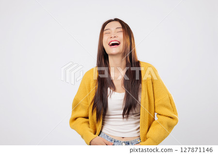 Laugh of freedom, laugh of fun Happy Asian woman enjoys a confident lifestyle moment, laughing joyfully with peace and a burst of expressive enjoyment. isolated white background 127871146