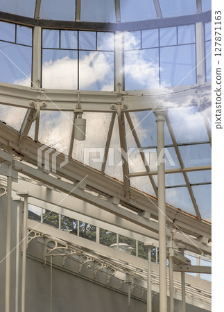 the conservatory with its clean lines, emphasis on functionality and use of materials like steel and glass. 127871163