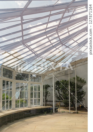 the conservatory with its clean lines, emphasis on functionality and use of materials like steel and glass. the conservatory with its clean lines, emphasis on functionality and use of materials like steel and glass. 127871164
