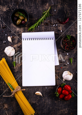 Italian food background with spaghetti, tomato and spices Italian food background with spaghetti, tomato and spices 127871186