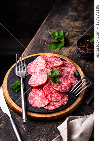Sliced spicy tasty salami sausage 127871188