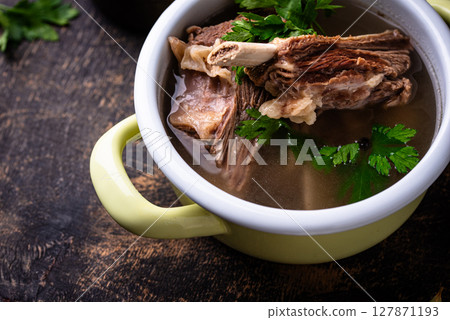 Boiled bone broth or bouillon with meat Boiled bone broth or bouillon with meat 127871193