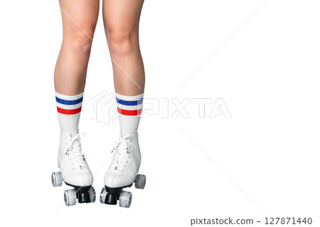 Female caucasian legs in roller skates and striped socks on white background Female caucasian legs in roller skates and striped socks on white background 127871440