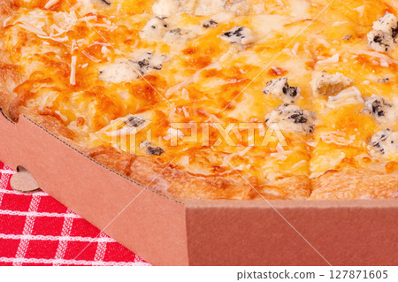 Macro photo of cheese pizza in a box on a red checkered tablecloth. Macro photo of cheese pizza in a box on a red checkered tablecloth. 127871605