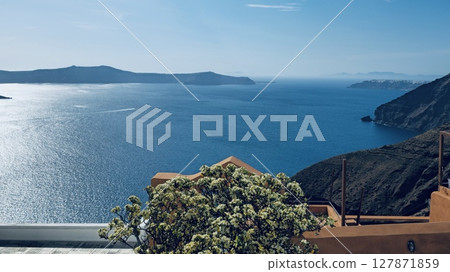 Santorini, Fira. View from the balcony overlooking the sea and nearby islands 127871859