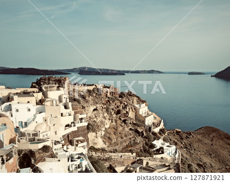 Santorini, the town of Oia, view of the town, cliffs, sea, and nearby islands 127871921