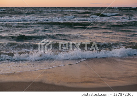 blurry photo of ocean against a sunset background. beauty in nature.  127872303