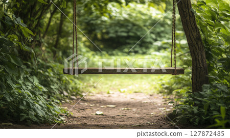 Empty forest swing in lush greenery for retreat and leisure concepts 127872485