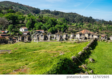 The communitarian granaries, called espigueiros, in the village of Lindoso, Peneda National Park, Northern Portugal 127872605