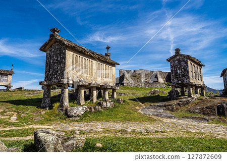The communitarian granaries, called espigueiros, in the village of Lindoso, Peneda National Park, Northern Portugal 127872609