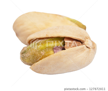 Pistachio nuts in shells, isolated on a white background Pistachio nuts in shells, isolated on a white background 127872811