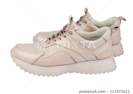 Women's leather sneakers isolated on white background. 127873012