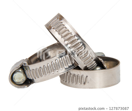 Construction steel clamp for tightening metal or plastic hose and pipes isolated on white background close up Construction steel clamp for tightening metal or plastic hose and pipes isolated on white background close up 127873087