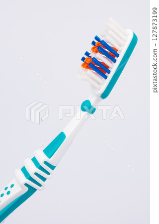Colored toothbrushes. Isolated on white background. Colored toothbrushes. Isolated on white background. 127873199