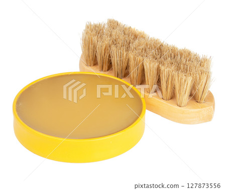 Wax polish with brush on white background. Shoe care accessories Wax polish with brush on white background. Shoe care accessories 127873556