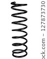 Car spare part. Large metal spring on white background. cushioning spring over white background, auto spare parts. automotive suspension springs on a white background 127873730