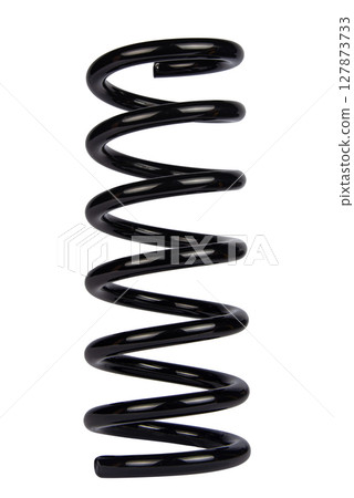 Car spare part. Large metal spring on white background. cushioning spring over white background, auto spare parts. automotive suspension springs on a white background 127873733