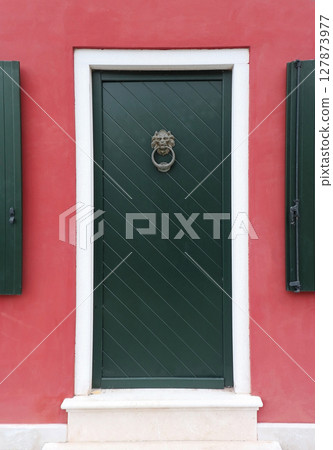 Lion head door knocker entrance 127873977