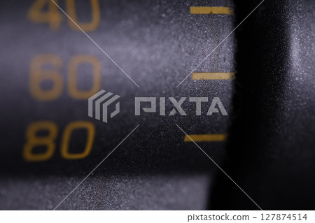 Gadget settings elements close up, macro photo, details on a dark background 127874514
