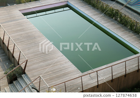 Outdoor swimming pool 127874638