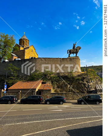 The view of the Metekhi church and the equestrian monument of King Vakhtang Gorgasali in Tbilisi, Georgia. High quality photo 127874681