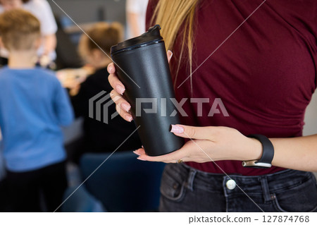 A Stylish Drink Container Perfect for Use in a Modern Car Interior, Both Functional and Fashionable 127874768