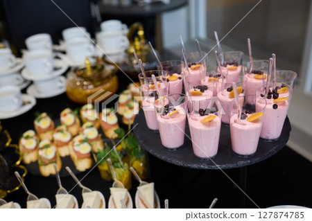 A Vibrantly Colorful Appetizer Platter Featuring Skewers and a Variety of Fresh Ingredients 127874785