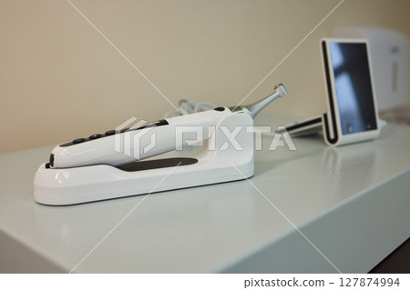 Contemporary Dental Equipment Placed on a Counter in a Modern Clinic or Dental Office Contemporary Dental Equipment Placed on a Counter in a Modern Clinic or Dental Office 127874994