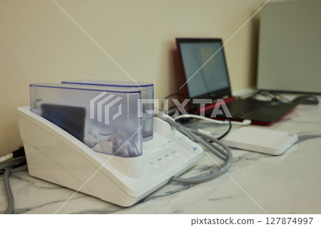 Advanced Imaging Equipment Placed on a Desk for Enhanced Functionality and Aesthetics Advanced Imaging Equipment Placed on a Desk for Enhanced Functionality and Aesthetics 127874997