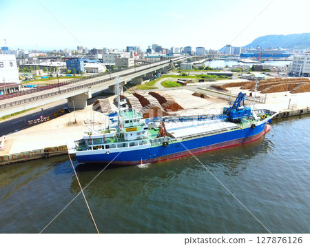 Aerial view of a cargo ship doing port work at Hakodate Port in Hakodate, Hokkaido in early summer 127876126