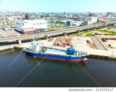 Aerial view of a cargo ship doing port work at Hakodate Port in Hakodate, Hokkaido in early summer 127876127