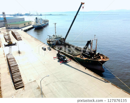 Aerial view of a cargo ship doing port work at Hakodate Port in Hakodate, Hokkaido in early summer 127876135