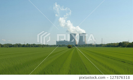 Nuclear power plant nestled in nature. Cooling towers emit steam plumes, contrasting industrial might with serene surroundings 127876318