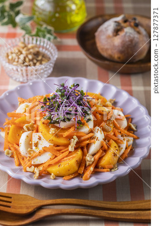 Persimmon, turnip and carrot salad Persimmon, turnip and carrot salad 127877371