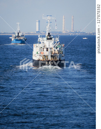 Cargo ship sailing in Tokyo Bay Cargo ship sailing in Tokyo Bay 127878382